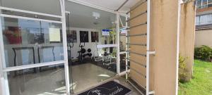 a room with sliding glass doors on the side of a building at Hotel Casa Enseada Guarujá in Guarujá