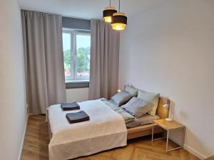 Postel nebo postele na pokoji v ubytování Kraków 2 Room Apartment Near Tauron Arena EXPO