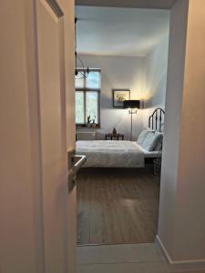 Ένα ή περισσότερα κρεβάτια σε δωμάτιο στο Apartament Wieżyczka +12 φωτογραφίες