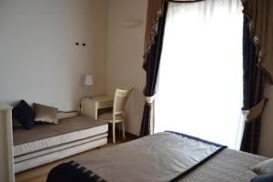 Postel nebo postele na pokoji v ubytování Agriturismo De Luca
