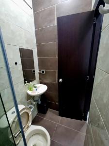 a bathroom with a toilet and a sink at Apto, kennedy central amoblado in Bogotá