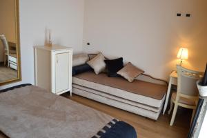 Postel nebo postele na pokoji v ubytování Agriturismo De Luca