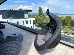 a large black sculpture on the roof of a building at Premium Penthouse in Keszthely