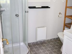 a shower with a glass door in a bathroom at 4 star holiday home in Slöinge in Slöinge +22 photos