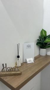 a shelf with scissors and a box on it at Calatafimi Rocca Home in Palermo +9 photos
