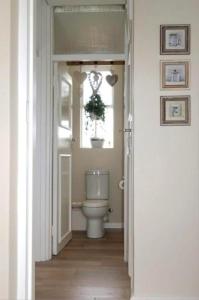 a bathroom with a toilet and a window at The Pearl in the Winelands in Paarl +14 photos