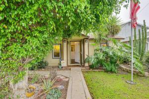 a green house with a tree in front of it at 2 Mi to Ocean Pet-Friendly Imperial Beach Retreat in Imperial Beach