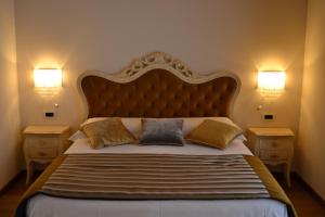 Postel nebo postele na pokoji v ubytování Agriturismo De Luca