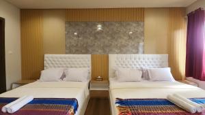 Ένα ή περισσότερα κρεβάτια σε δωμάτιο στο THE MARIS 3BR Villa Vimala Hills