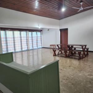 a room with two ping pong tables in it at KITH and KIN in Colombo