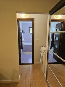 a laundry room with a washer and dryer at Apartament modern cu 2 camere in Vaslui, zona Cartier in Vaslui