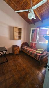 Postel nebo postele na pokoji v ubytování Casa en Barrio Ceramista 1 - Rawson