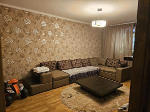 a living room with a couch and a coffee table at Apartament modern cu 2 camere in Vaslui, zona Cartier in Vaslui