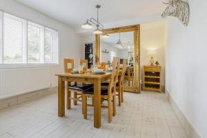 a dining room with a table and chairs and a mirror at 3 Bed in Forden oc-c30173 in Forden