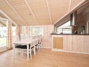 a kitchen and dining room with a table and chairs at 5 star holiday home in Vestervig in Vestervig