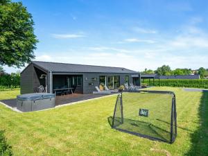 a home with a yard with a house at 5 star holiday home in Hejls in Hejls