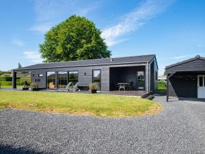 a modular home with a patio and a yard at 5 star holiday home in Hejls in Hejls +31 photos