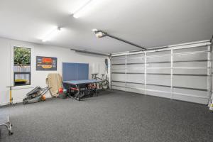 a garage with a ping pong table in it at Getaway on Galloway - Close to the Lake in Wanaka