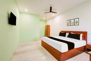 Ένα ή περισσότερα κρεβάτια σε δωμάτιο στο Super Hotel O Shine Inn