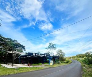 a gas station on the side of a road at Glamping Finca garza del sol in El pilon