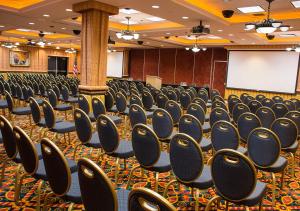 a conference room with rows of chairs and a whiteboard at Rainbow Hotel Casino by Peppermill Resorts in West Wendover