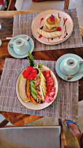 a table with plates of food on top at Ella Ceylonka in Ella +74 photos