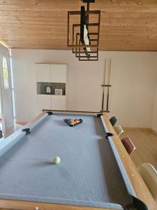 a pool table in the middle of a room at L'Ancienne Scierie in Ban-sur-Meurthe-Clefcy +27 photos