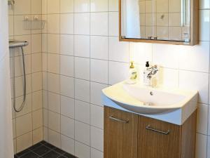 a bathroom with a sink and a shower at 4 star holiday home in kode in Kode +13 photos