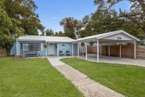 a blue house with a pavilion in a yard at 3 Bedroom Gulfport Rental by Next Step Property Management in Gulfport