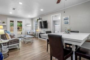 a kitchen and living room with a table and chairs at 3 Bedroom Gulfport Rental by Next Step Property Management in Gulfport