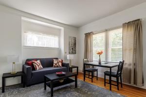 a living room with a couch and a table at 3 Berkeley - 1 Bedroom Apartment, with Laundry in Berkeley