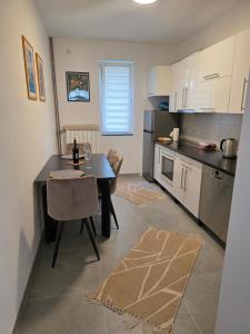 Kuchyň nebo kuchyňský kout v ubytování Apartman Omerovic - Panon Centar Tuzla