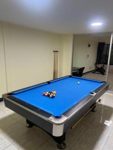 a pool table in a room with at Treff nad phop hotel in Patong Beach