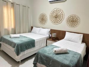 Katil atau katil-katil dalam bilik di Chalet Vista Lençóis Santo Amaro +16 gambar