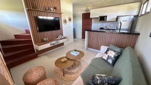 Televisyen dan/atau pusat hiburan di Chalet Vista Lençóis Santo Amaro