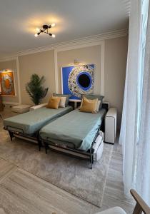 En eller flere senge i et værelse på Apartamento T1 Luxo Marina Vilamoura