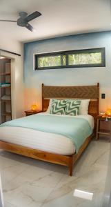 a bedroom with a large bed and a window at Casa Sebas at Riviera Maya in Xpu Ha +63 photos