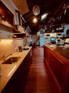 a kitchen with a sink and a counter top at HdeC Hosteria de Castañeda Alojamiento Turistico in Puente Viesgo +52 photos