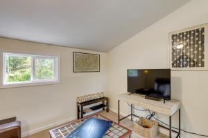 a living room with a couch and a table at Appalachian Mtn Retreat 4 Mi to Grovewood Village in Asheville
