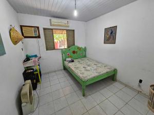 Ένα ή περισσότερα κρεβάτια σε δωμάτιο στο Casa do Sítio Amazônia - COP30 +12 φωτογραφίες
