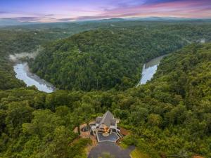 an aerial view of a house in the woods next to a river at Perch in the Clouds Hot Tub Stunning Views in Ellijay