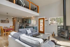 a living room with a couch and a table at Private Deck Secluded Fairplay Cabin in Fairplay
