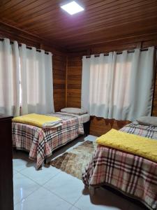 Ένα ή περισσότερα κρεβάτια σε δωμάτιο στο Eco Cabana Mantiqueira +30 φωτογραφίες