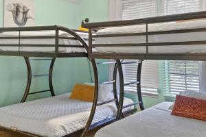 a couple of bunk beds in a room at Spacious Retreat for Crews, Corporates & Families in Houston