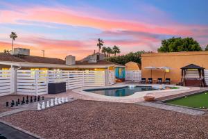 a backyard with a pool and a house at Bray House - Epic Shared Backyard - Pool - Games in Phoenix