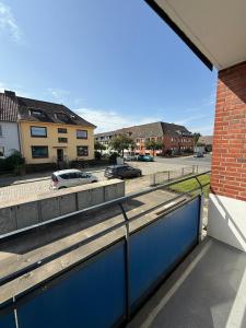 a view of a parking lot with cars on a street at Apartment Cozy Note für 2 in Bremerhaven