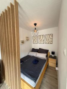 a bedroom with a large bed in a room at Apartment Cozy Note für 2 in Bremerhaven