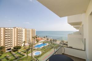a view of the ocean from a balcony of a building at Ocean House Apartamento Exclusivo Vista Mar B3 Plta 8 by Costa del Sol Stay in Torremolinos