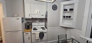 a kitchen with a white refrigerator and a stove at Private Apt In Middletown-wesleyan in Middletown