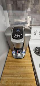 a coffee maker sitting on a counter next to a stove at Private Apt In Middletown-wesleyan in Middletown